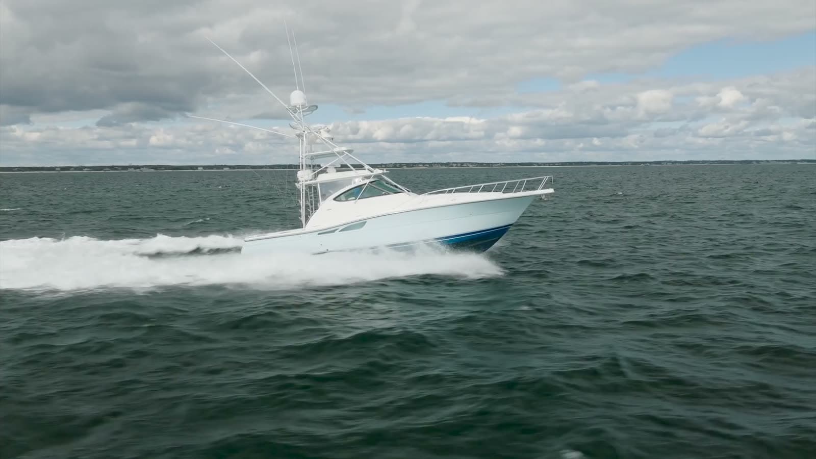 A sportfishing convertible running offshore